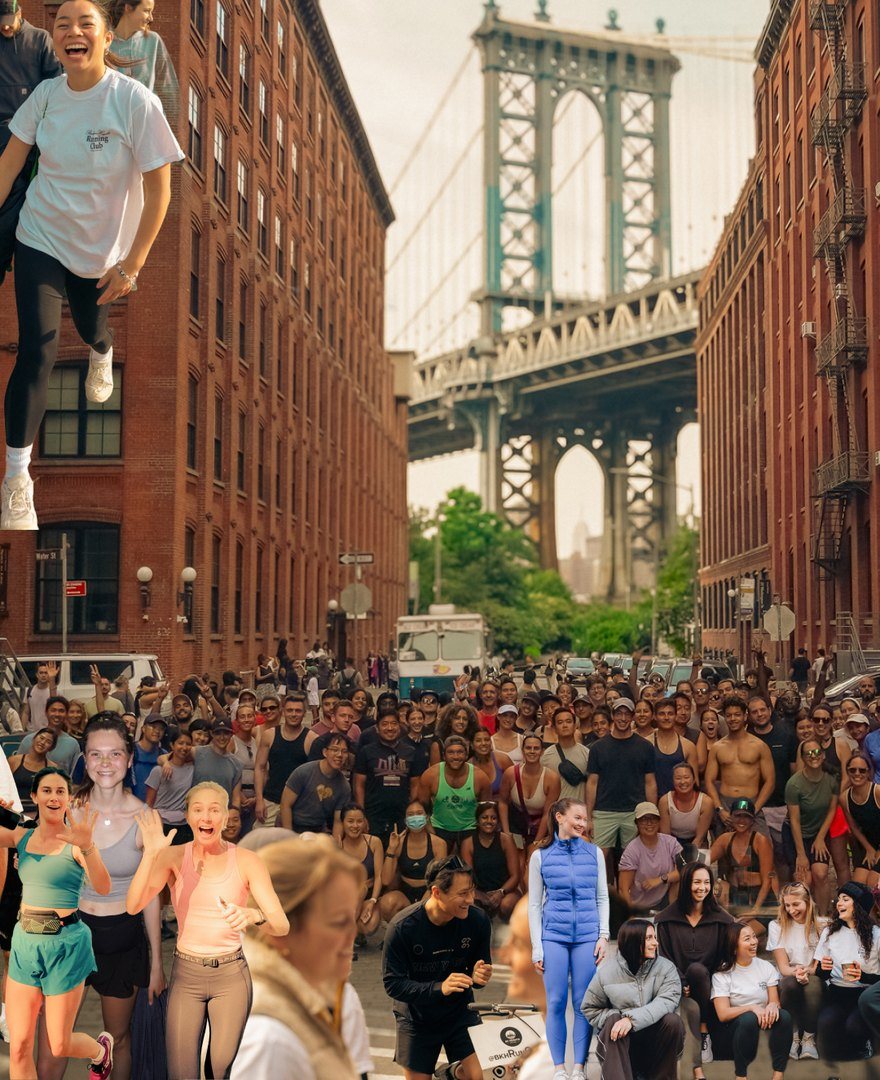 A crowd of club runners in DUMBO under the Manhattan Bridge
